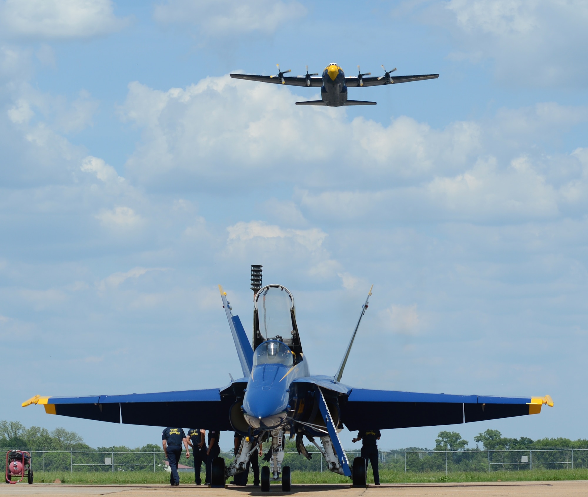 The U.S. Navy Flight Demonstration Team Blue Angels C-130 Hercules, Fat Albert, soars over an F/A-18 Hornet during the 2015 Defenders of Liberty Air Show at Barksdale Air Force Base, Louisiana, May 2. The mission of the Blue Angels is to showcase the pride and professionalism of the United States Navy and Marine Corps by inspiring a culture of excellence and service to country through flight demonstrations and community outreach. (U.S. Air Force photo/Senior Airman Benjamin Gonsier)