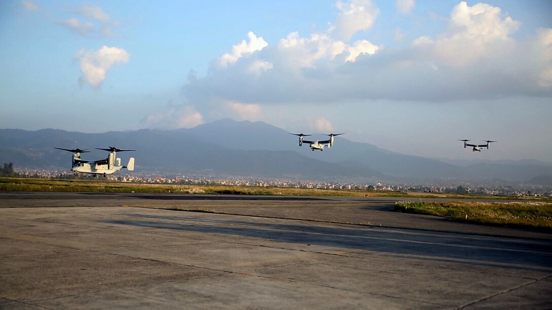 U.S. Marine V-22 Ospreys fly into Tribhuvan International Airport in Kathmandu, Nepal, May 3. U.S. Marines also brought an UH-1N Huey, tools and equipment to support the government of Nepal. The Nepalese Government requested the U.S. Government’s help after a 7.8 magnitude earthquake struck their country, April 25. The Marines are with Marine All-Weather Fighter Attack Squadron 242, Marine Aircraft Group 12, I Marine Aircraft Wing, III Marine Expeditionary Force. (U.S. Marine Corps photo by Lance Cpl. Mandaline Hatch/Released)