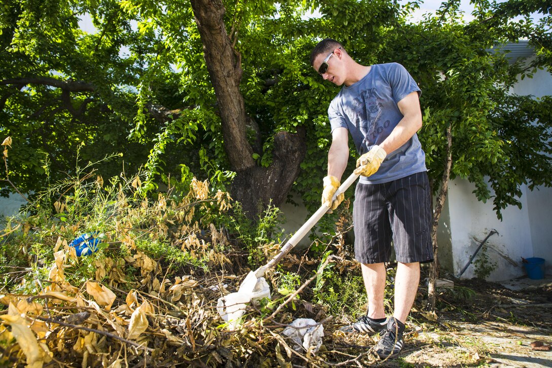 A Marine with Special-Purpose Marine Air-Ground Task Force Crisis Response-Africa clears brush from the garden at the Santa Clara convent in Morón, Spain, April 23, 2015. The convent is nearly five-centuries old, and the Marines helped restore parts of the compound to help the Poor Clare Sisters maintain the facility’s beautiful interior. (U.S. Marine Corps photo by Sgt. Paul Peterson/Released)