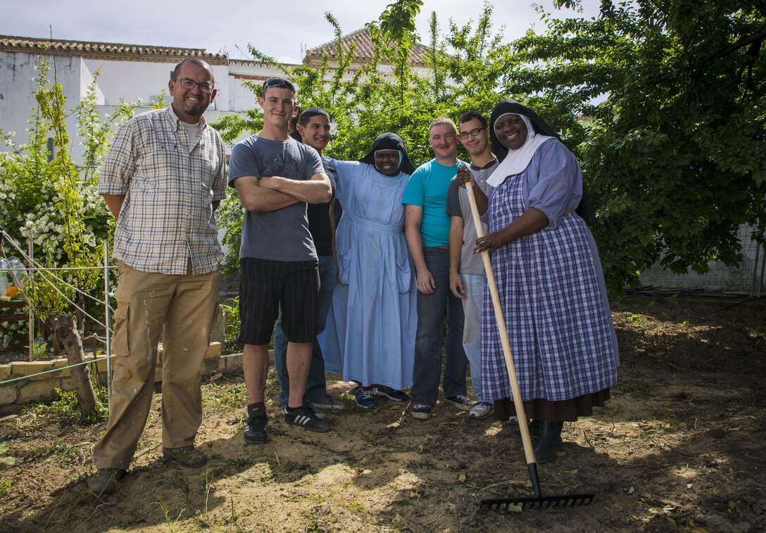 U.S. service members with Special-Purpose Marine Air-Ground Task Force Crisis Response-Africa pose for a photo with members of the Santa Clara convent in Morón, Spain, April 23, 2015. The sisters dedicated themselves to a path of prayer, simplicity, community and a spirit of joy, while living much of their lives within the compound walls. (U.S. Marine Corps photo by Sgt. Paul Peterson/Released)