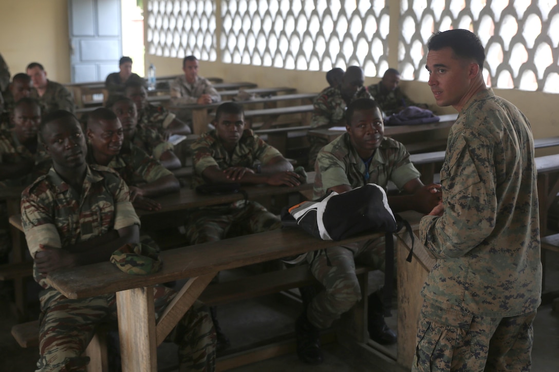U.S. Marine Sgt. Ben Sheely, a squad leader with Special-Purpose Marine Air-Ground Task Forces Crisis Response-Africa, gives a class on marksmanship for the Cameroonian Naval Commando Company, near Limbe, Cameroon, March 12, 2015. Sheely is part of a Theater Security Cooperation team, which traveled to Cameroon to conduct an engagement focused on marksmanship and other basic infantry skills with the COPALCO during the multinational maritime security exercise, Africa Partnership Station. (Official U.S. Marine Corps photo by Staff Sgt. Steve Cushman/Released)