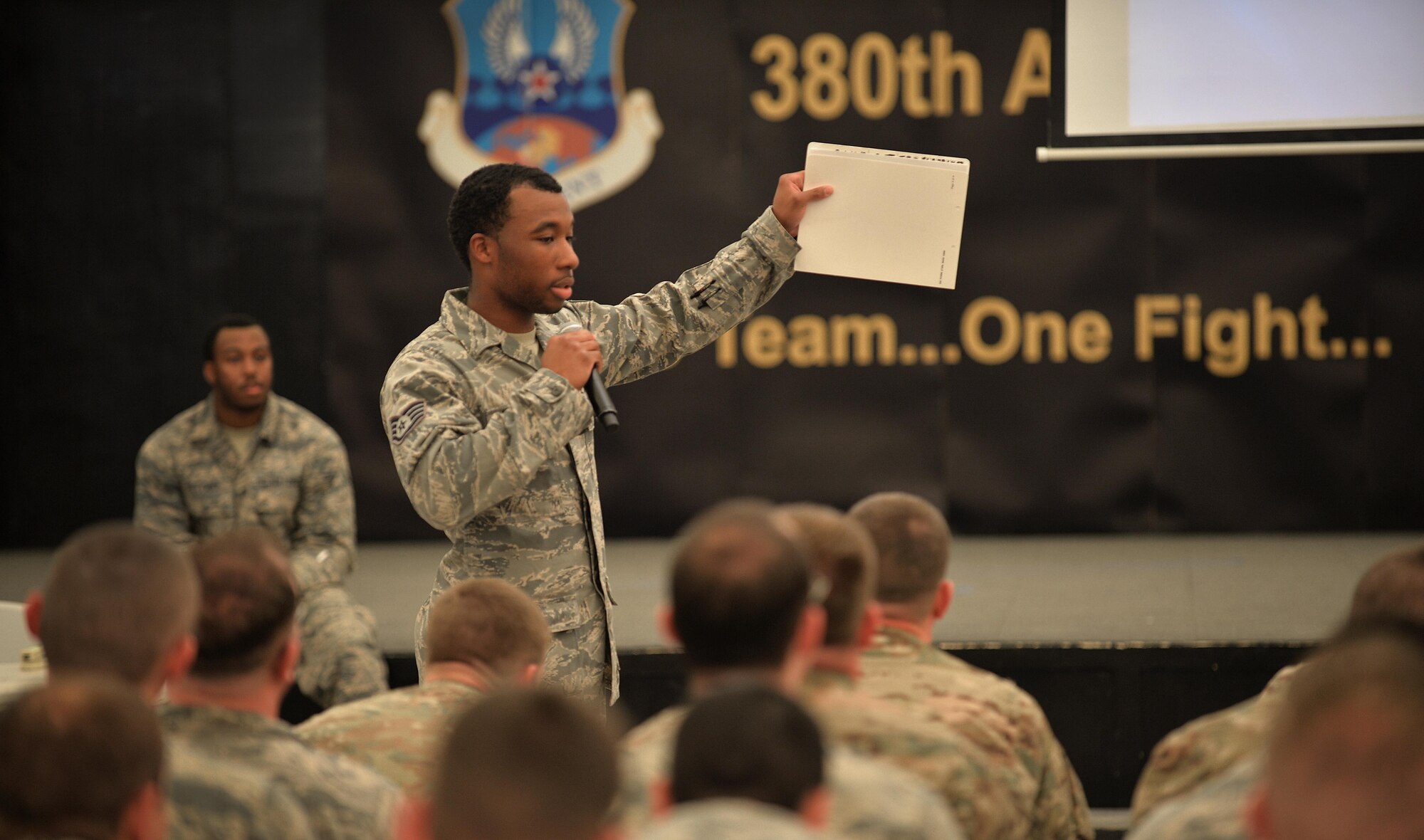 Staff Sgt. Demetrius, public health technician, briefs new personnel about their medical records during inprocessing at an undisclosed location in Southwest Asia April 24, 2015. The Public Health team screens all new members to ensure they arrived with the required medical records. (U.S. Air Force photo/Tech. Sgt. Jeff Andrejcik)