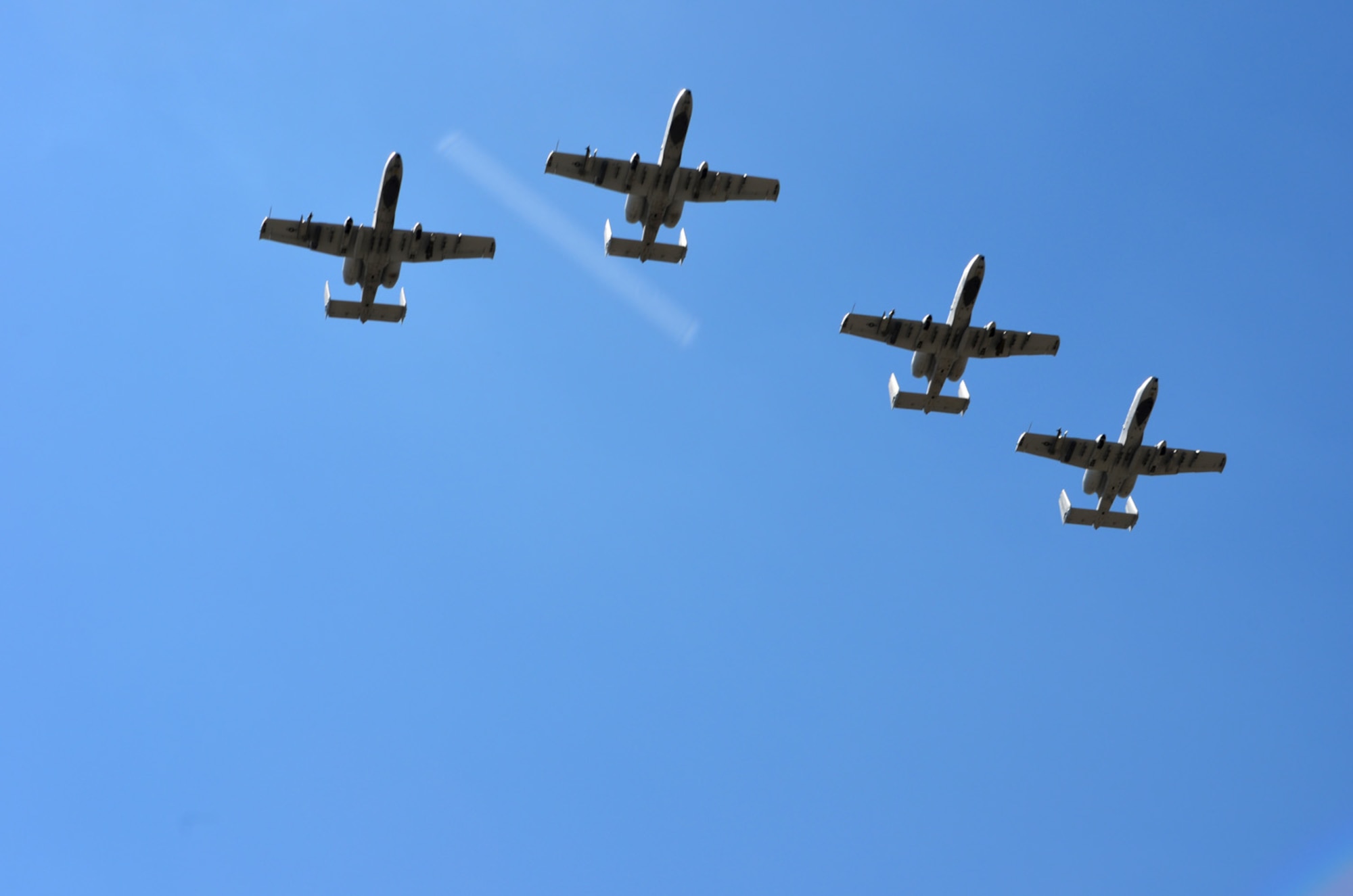Four A-10 Thunderbolt’s with the 303rd Fighter Squadron, Whiteman Air Force Base, Missouri, perform a fly-over for Capt. Kyle Babbit, 303d Fighter Squadron A-10 Thunderbolt II pilot, at the Air Force Academy May 1. Babbit received The Jabara Award for Airmanship for his selfless actions while deployed downrange September 2013 – October 2014. (U.S. Air Force photo by Capt. Denise Haeussler)

