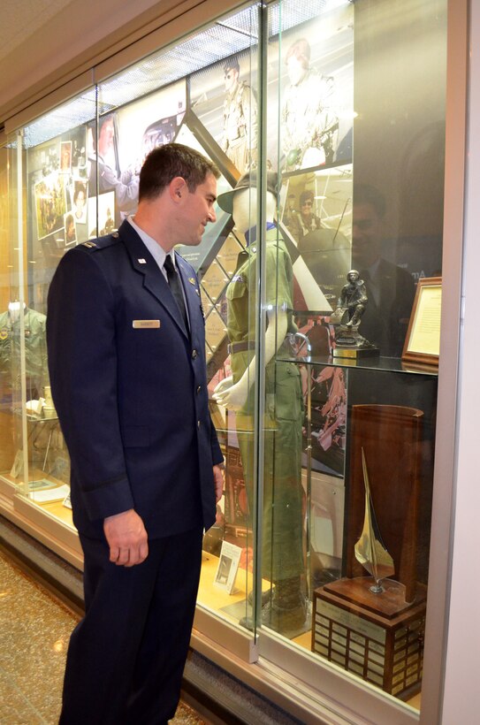 Capt. Kyle Babbit, 303d Fighter Squadron A-10 Thunderbolt II pilot, checks out The Jabara Award for Airmanship at the Air Force Academy May 1. Babbit, a 2008 Academy graduate is the latest recipient of this award. (U.S. Air Force photo by Capt. Denise Haeussler)
