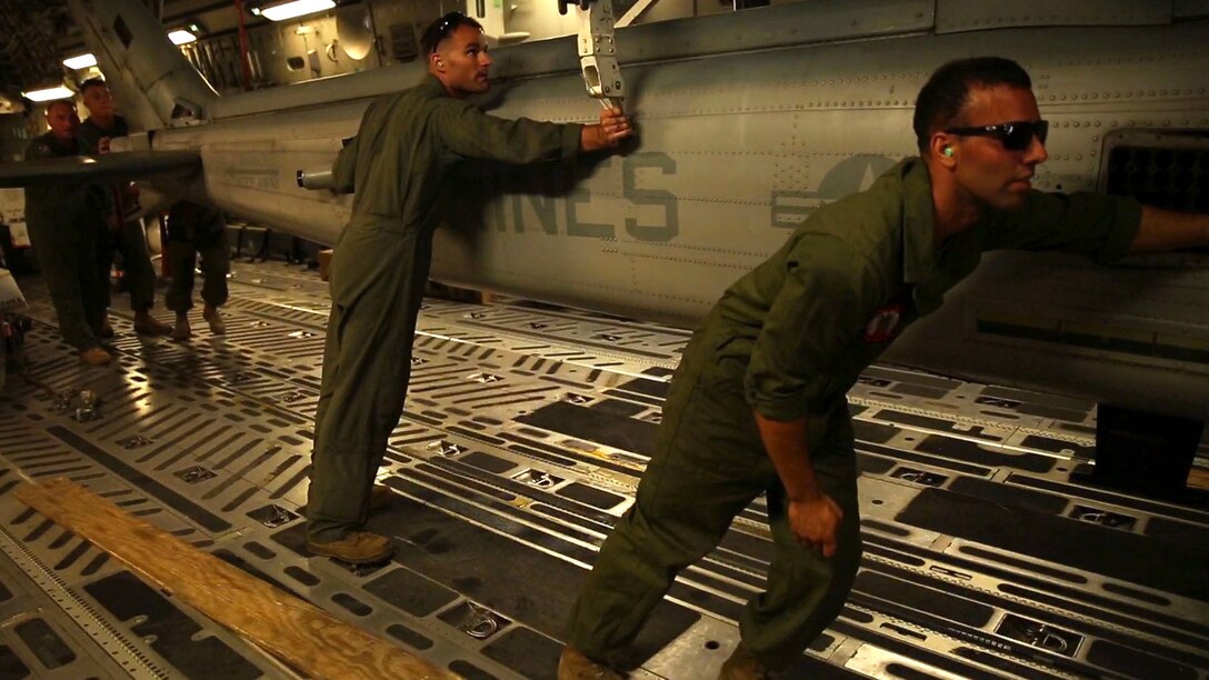 U.S. Marines, Lance Cpl. David H. Serrano (right) and Staff Sgt. Joseph Thomas, unload a UH-1N Huey off of a Boeing C-17 Globemaster III onto Tribhuvan International Airport in Kathmandu, Nepal, May 3. Marines brought a Huey, tools and equipment to support the government of Nepal. The Nepalese Government requested the U.S. Government’s help after a 7.8 magnitude earthquake struck their country, April 25. The Marines are with Marine Light Attack Helicopter Squadron 469, Marine Air Group 36, I Marine Aircraft Wing, III Marine Expeditionary Force. Serrano is from Plattekill, New York. (U.S. Marine Corps photo by Lance Cpl. Mandaline Hatch/Released)