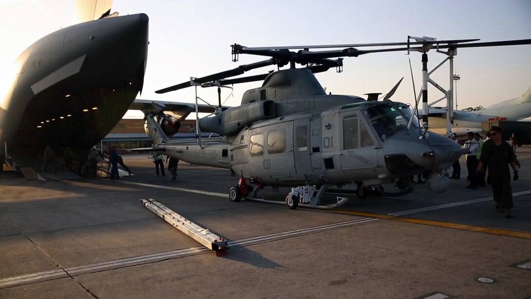 U.S. Marines unload a UH-1N Huey off of a Boeing C-17 Globemaster III onto Tribhuvan International Airport in Kathmandu, Nepal, May 3. Marines brought a Huey, tools and equipment to support the government of Nepal. The Nepalese Government requested the U.S. Government’s help after a 7.8 magnitude earthquake struck their country, April 25. The Marines are with Marine Light Attack Helicopter Squadron 469, Marine Air Group 36, I Marine Aircraft Wing, III Marine Expeditionary Force. (U.S. Marine Corps photo by Lance Cpl. Mandaline Hatch/Released)