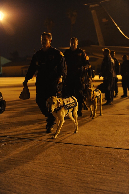 Canine handlers from an elite 57-person team, known as the Urban Search and Rescue Task Force 2 (CA-TF2), board a C-17 Globemaster III aircraft at March ARB, Calif., April 26, 2015. The CA-TF2 team, sponsored by the Los Angeles County Fire Department, Calif., was activated by the U.S. Agency for International Development’s Office of U.S. Foreign Disaster Assistance on Sunday to deploy to Nepal in support of earthquake emergency rescue operations.

(U.S. Air Force photo/Senior Airman Russell S. McMillan)
