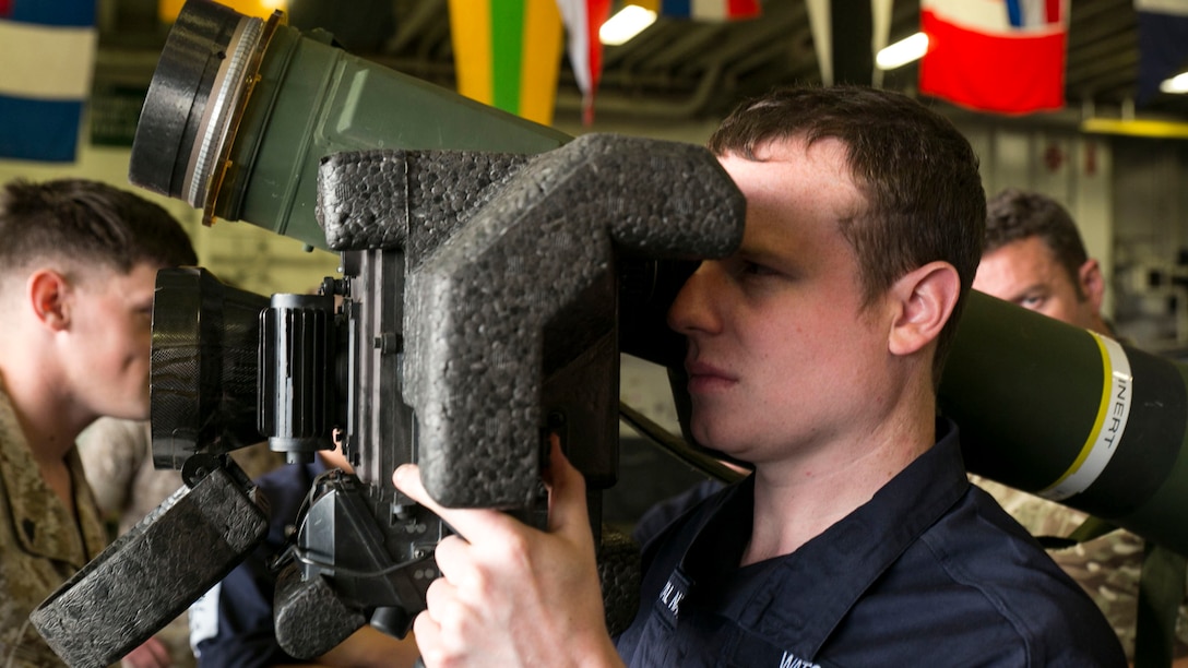 British Royal Navy Petty Officer Marine Engineer Elliott Watson, a refrigeration engineer with the HMS Lancaster, looks through the viewing display of a Javelin shoulder-fired anti-tank missile during a tour aboard the amphibious assault ship USS Wasp (LHD 1) while out at sea April 30, 2015. U.S. Marines and U.S. Navy sailors with the 22nd Marine Expeditionary Unit from Marine Corps Base Camp Lejeune, North Carolina, participated in Navy Week 2015 in New Orleans April 23-29 and Fleet Week Port Everglades, Florida, May 4-10. The purpose of Navy Week was to showcase the strength and capabilities of the Navy-Marine Corps team through tours, static displays and community relations events, providing the public the opportunity to meet and interact with Marines and sailors. (U.S. Marine Corps photo by Sgt. James R. Smith/Released)