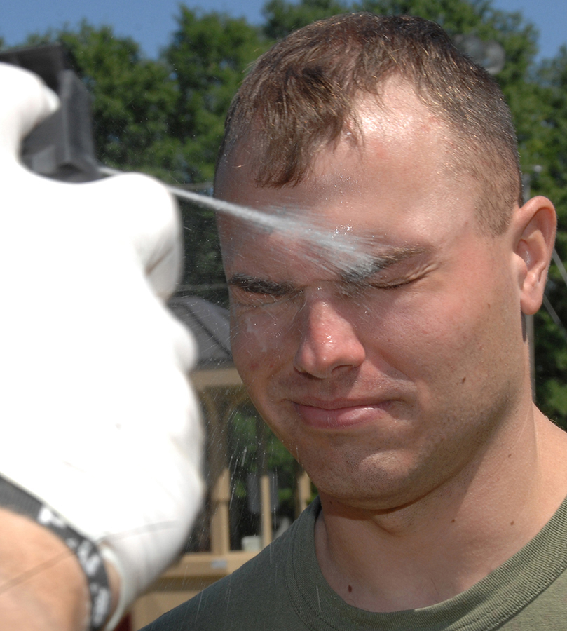 Security Augment Force student Sgt. Tye Alexander receives a stream of oleoresin capsicum spray, better known as pepper spray, during nonlethal weapons training hosted by Marine Corps Logistics Base Albany’s Marine Corps Police Department, May 1. 