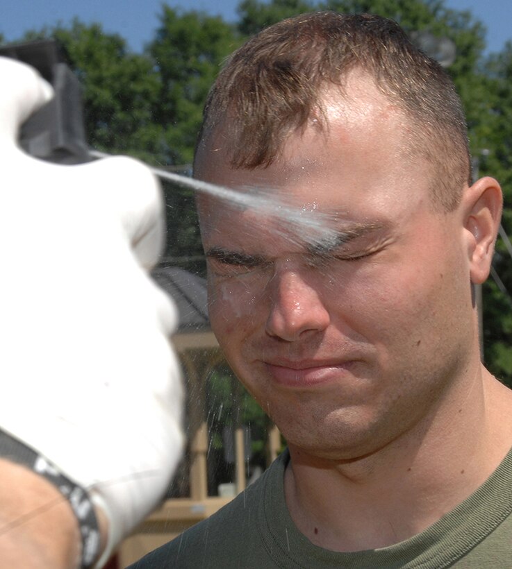 Security Augment Force student Sgt. Tye Alexander receives a stream of oleoresin capsicum spray, better known as pepper spray, during nonlethal weapons training hosted by Marine Corps Logistics Base Albany’s Marine Corps Police Department, May 1. 