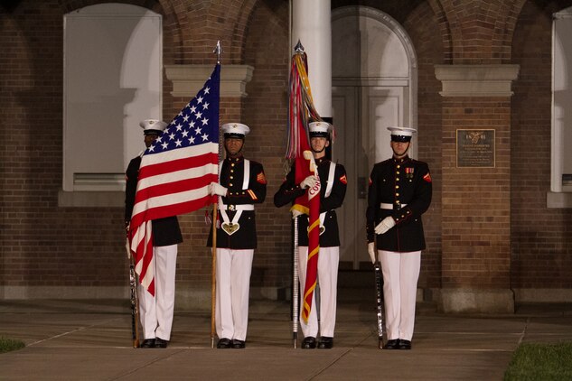 The Marine Corps Color Guard performs during a Friday Evening Parade at Marine Barracks Washington, D.C., May 1, 2015. (Official Marine Corps photo by Cpl. Skye Davis/ Released)