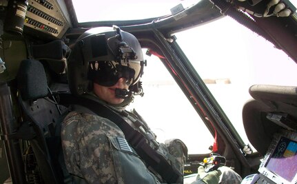 Army Maj. Matthew Strub of Headquarters Company, 1st battalion, 147th Aviation Regiment, prepares to head out on a recent mission in Iraq. The UH-60 Black Hawk helicopter unit, which is based in Madison, Wis., has been in Iraq since September in support of Operation New Dawn.