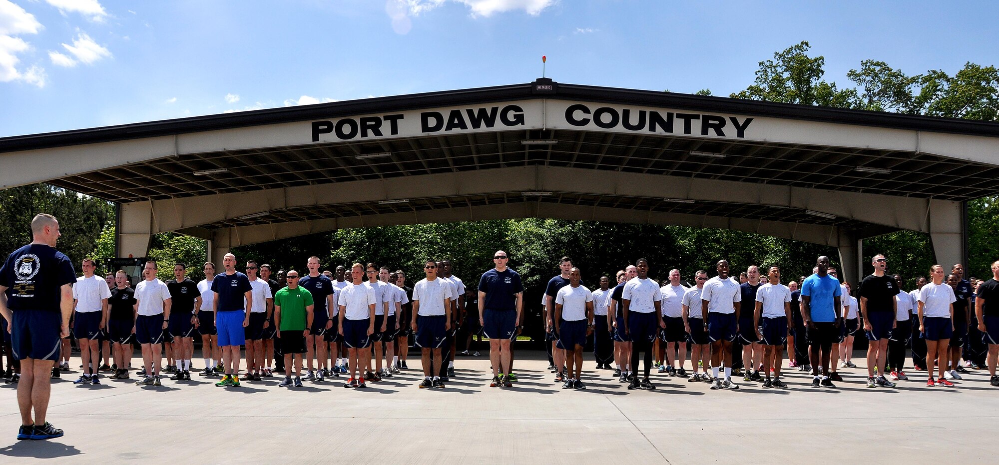 Members of Dobbins Air Reserve Base stand in formation during the Port Dawg Memorial Run on Dobbins ARB, Ga., May 3, 2015.  Air transportation Airmen from the 94th Aerial Port Squadron, as well as members from other base units, participated in the run honoring fallen Airmen from their career field. The run was part of a coordinated event with other air transportation units from across the globe holding similar memorial runs. (U.S. Air Force photo/Senior Airman Daniel Phelps)