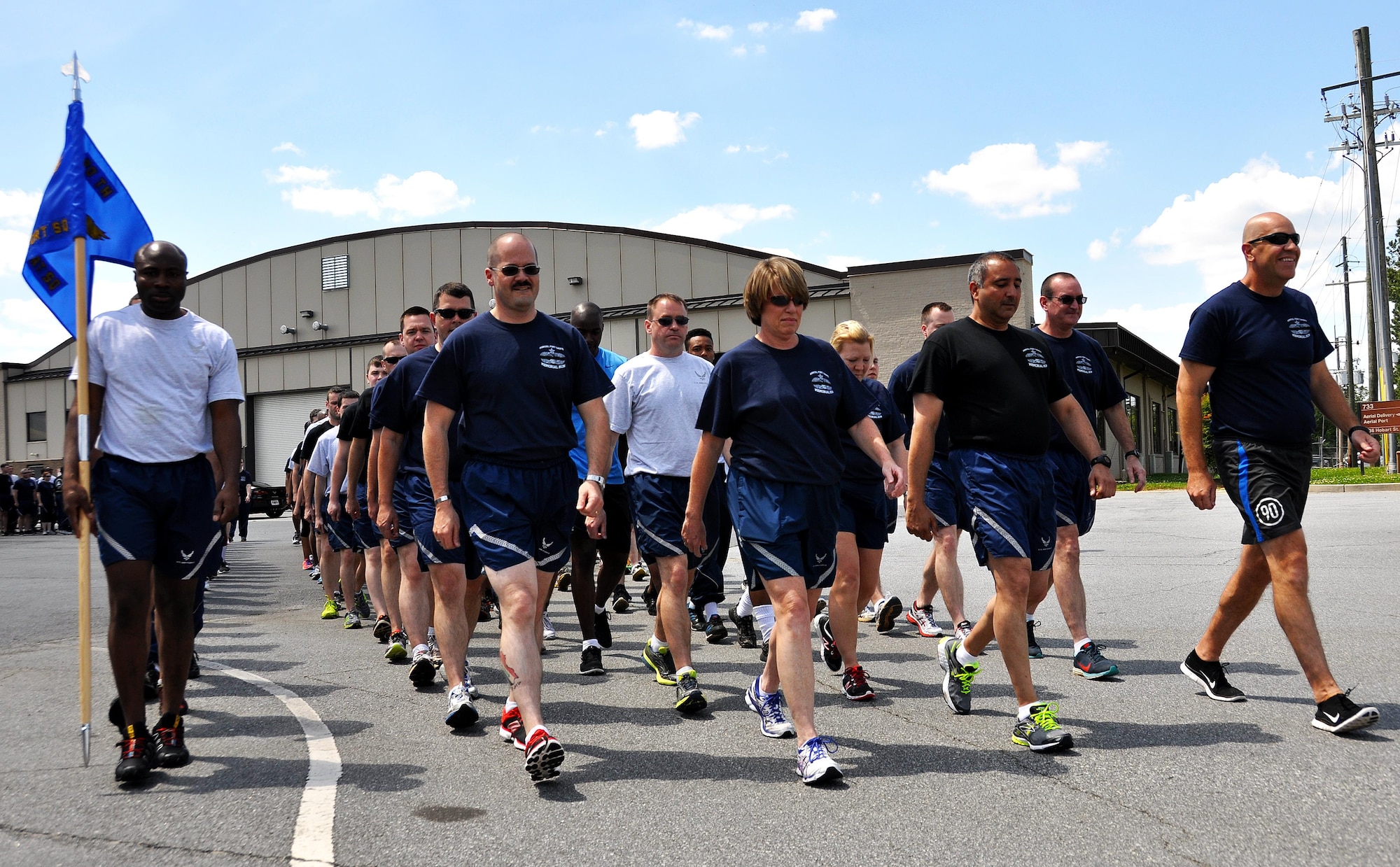 Members of Dobbins Air Reserve Base begin the Port Dawg Memorial Run on Dobbins ARB, Ga., May 3, 2015.  Air transportation Airmen from the 94th Aerial Port Squadron, as well as members from other base units, participated in the run honoring fallen Airmen from their career field. The run was part of a coordinated event with other air transportation units from across the globe holding similar memorial runs. (U.S. Air Force photo/Senior Airman Daniel Phelps)