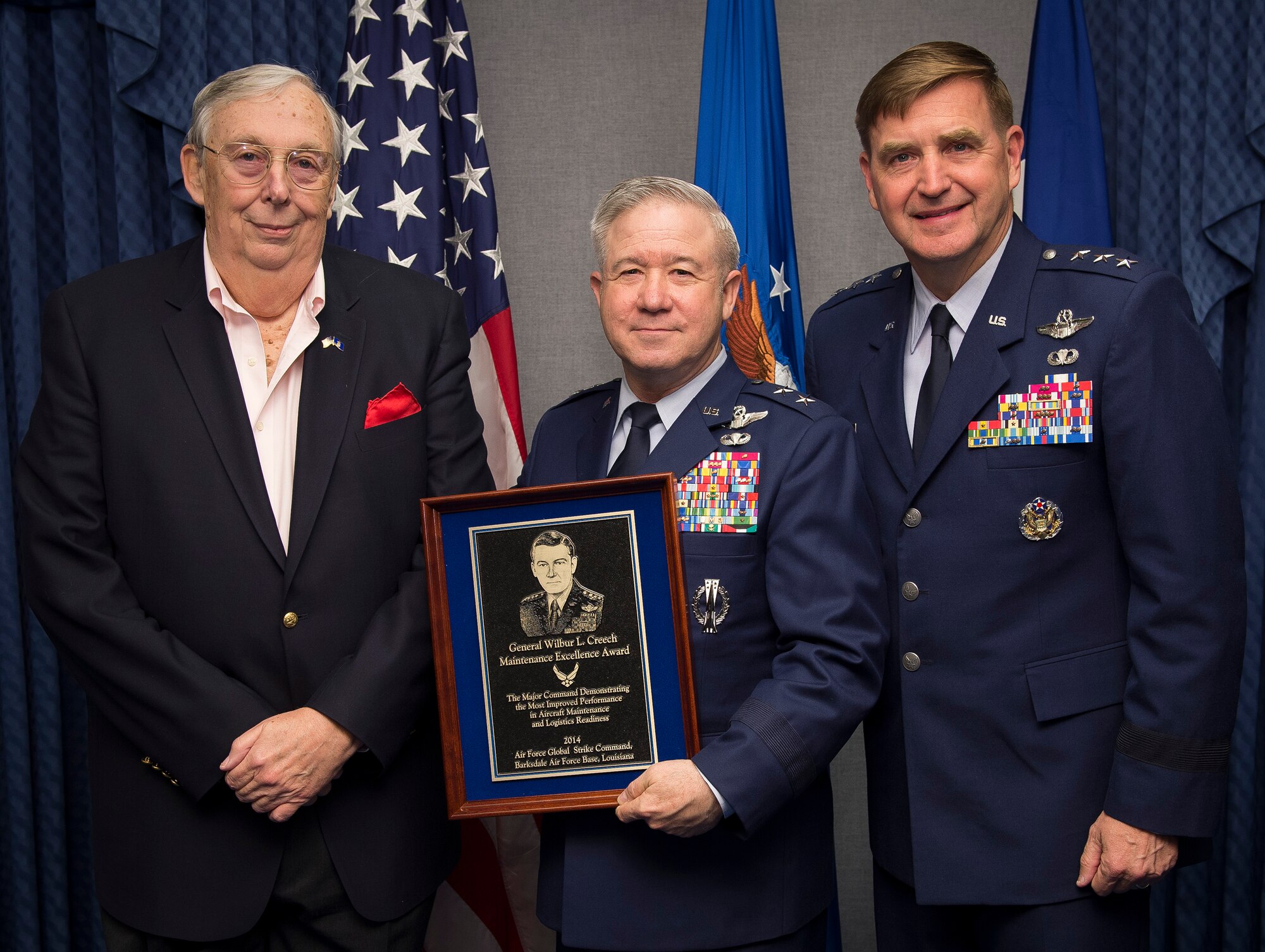 Air Force Assistant Vice Chief of Staff Lt. Gen. Stephen Hoog (right) presents the Gen. Wilber L. Creech Maintenance Excellence Award to Maj. Gen. Keith Kries (center) on behalf of Air Force Global Strike Command, during a ceremony in the Pentagon, Washington, D.C., April 28, 2015. The award recognizes the major command demonstrating the most improved performance in aircraft maintenance and logistics readiness in a given fiscal year. Also pictured is Dr. James G. Roche who was the 20th secretary of the Air Force. (U.S. Air Force photo/Jim Varhegyi)