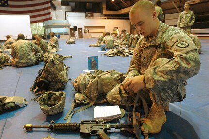 Army Staff Sgt. Adam Little of the Michigan National Guard replaces his sling as part of his equipment check during the 2010 Army Best Warrior Competition at Fort Lee, Va., Oct. 20, 2010. Little became the National Guard's top non-commissioned officer after winning the National Guard Best Warrior competition at Fort Benning, Ga., in July.