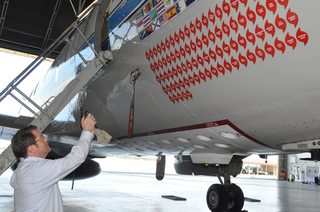 Paul Prince, a volunteer with the SC Employer Support of the Guard and Reserve takes a photo of an aircraft used by the National Oceanic and Atmospheric Administration to gain vital information from hurricanes and tropical storms that threaten the east coast. Prince was part of the SC ESGR Bosslift that visited MacDill AFB, Fl. April 30-May 1. (U.S. Air Force photo by Capt. Joe Simms)
