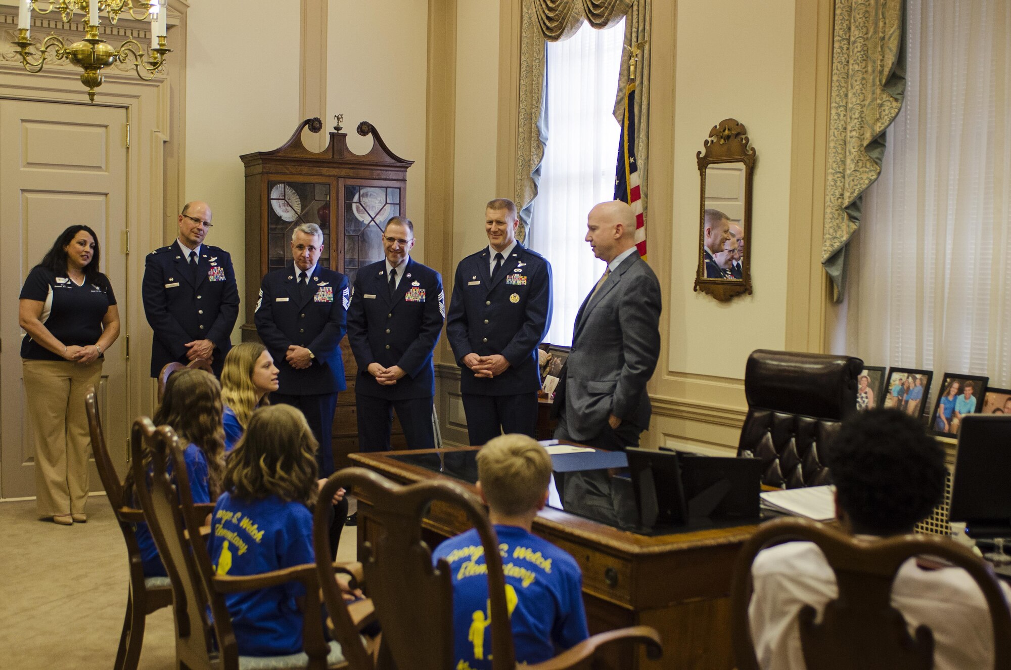 Delaware Governor Jack Markell (right, standing) listens to Welch Elementary student Abigail Gordon speak on her experiences and challenges of being a child of a military member, April 30, in his office. Last year, Gov. Markell signed a proclamation that declared April 30 as the Day of Recognition of the Military Child to show appreciation for the many challenges that are unique to their situation, such as having a parent deployed for extended periods of time and moving frequently. (U.S. Air Force photo by: Capt. Bernie Kale)
