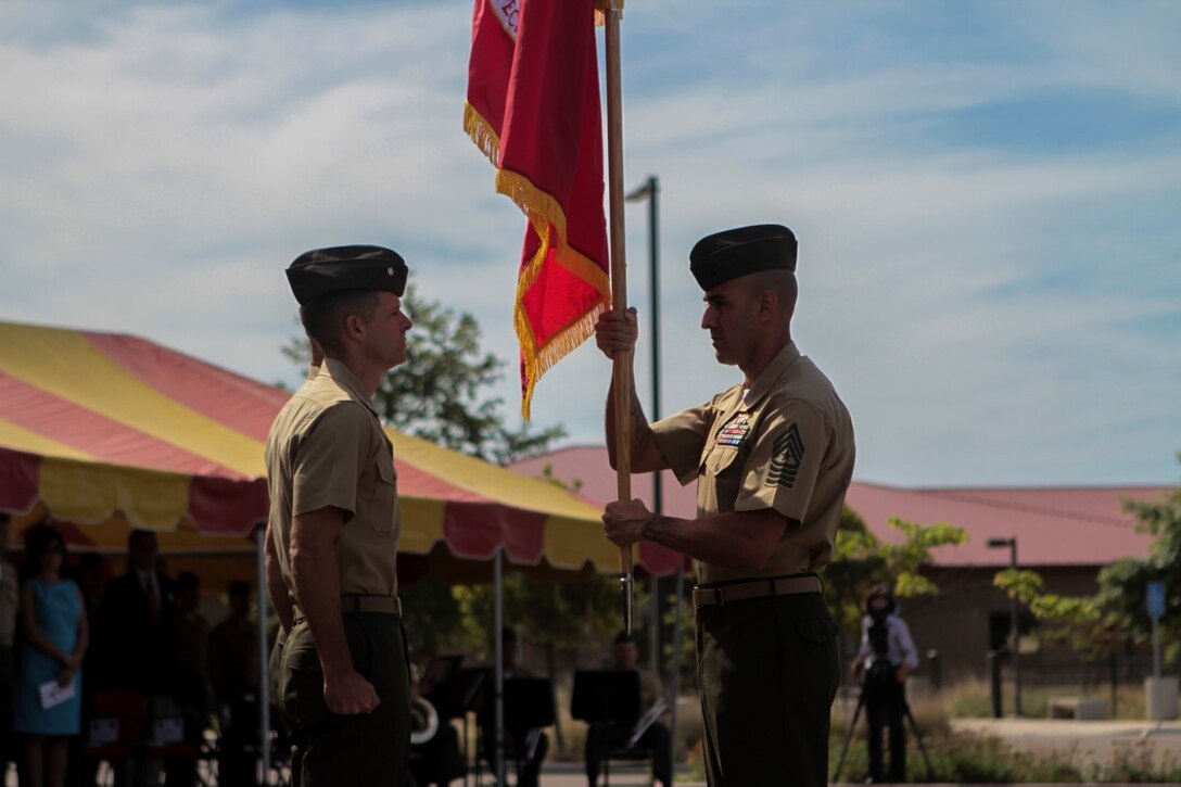 Sgt. Maj. Robert M. Tellez, battalion Sergeant Major, delivers the unit colors to Lt. Col. John J. Lynch during 1st Marine Special Operations Battalion’s change of command ceremony aboard Marine Corps Base Camp Pendleton, California, May 1, 2015. Lt. Col. Lynch passed the colors and relinquished his command to Lt. Col. Andrew R. Christian. (U.S. Marine Corps photo by LCpl. Danielle Rodrigues)