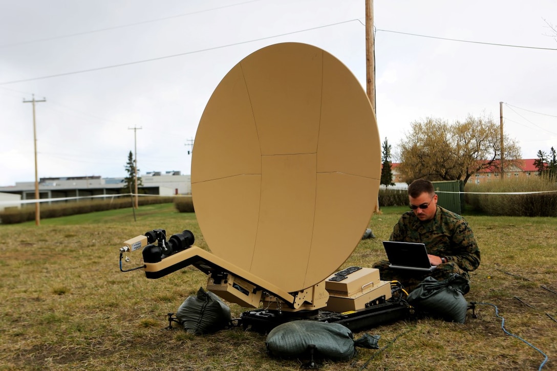 Sgt. Timothy Shirey, the data chief with 1st Air Naval Gunfire Liaison Company, evaluates and checks signal strength on a Rapid Response Kit during Exercise Maple Resolve 15 aboard Camp Wainwright Canadian Maneuver Training Center, Alberta, May 3, 2015. The Marines used the exercise to develop a knowledge platform to train for future operations and integrate with allied forces. (U.S. Marine Corps photo  by Cpl. Owen Kimbrel)