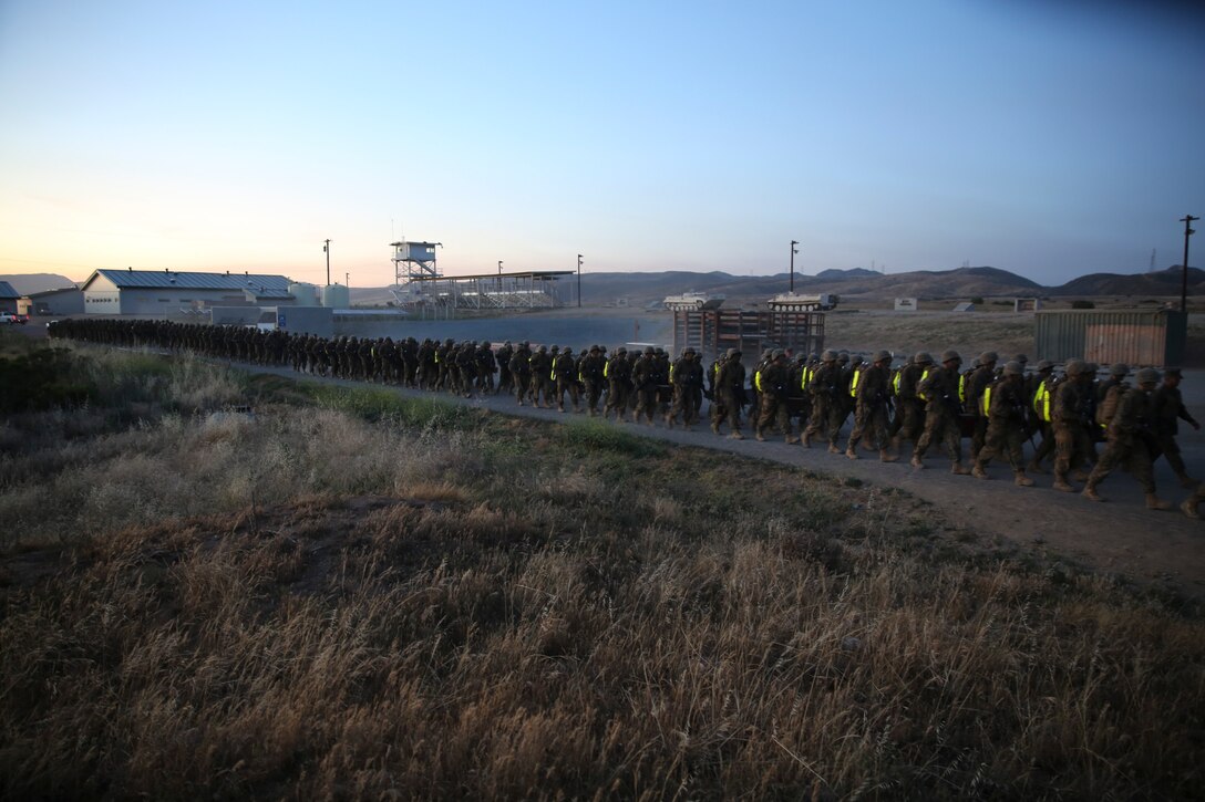 Recruits and drill instructors of Golf Company, 2nd Recruit Training Battalion, begin the resupply hike during the Crucible at Edson Range, Marine Corps Base Camp Pendleton, Calif., April 28. The Crucible is 54-hour training exercise where recruits are pushed to their limits. They hike more than 40 miles, stopping at stations to read award citations from past Marines and also conducting team exercises while experiencing food and sleep deprivation. The hike was approximately six kilometers and recruits carried ammunition cans to simulate a combat environment. One of the objectives of the hike was to rehearse noise discipline and practice maneuverability through darkness.  Today, all male recruits recruited from recruiting stations west of the Mississippi are trained at MCRD San Diego. The depot is responsible for training approximately 16,000 recruits annually. Golf Company is scheduled to graduate May 8.