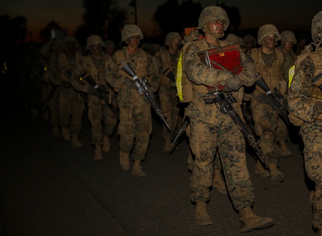 Recruits of Golf Company, 2nd Recruit Training Battalion, walk along the route during the resupply hike at Edson Range, Marine Corps Base Camp Pendleton, Calif., April 28. The ammunition resupply hike is six kilometers and recruits take turns carrying various size ammunition cans filled with dirt simulating the weight of the rounds. Halfway through the maneuver, the ammunition cans were handed over to the company’s follow series to carry back.  Today, all male recruits recruited from recruiting stations west of the Mississippi are trained at MCRD San Diego. The depot is responsible for training approximately 16,000 recruits annually. Golf Company is scheduled to graduate May 8.