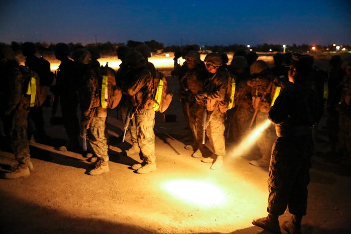 Recruits of Golf Company, 2nd Recruit Training Battalion, stop at the half-way point during the resupply hike at Edson Range, Marine Corps Base Camp Pendleton, Calif., April 28. During the stop, drill instructors conducted headcounts while recruits fixed their gear and hydrated. As the hike continued, the recruits tested their stamina and endurance by navigating the loose dirt and hills while trying to stay together as a group. Along with the ammunition cans, recruits carried a load bearing vest, their M16-A4 Service Rifle, their day packs and two canteens full of water. Today, all male recruits recruited from recruiting stations west of the Mississippi are trained at MCRD San Diego. The depot is responsible for training approximately 16,000 recruits annually. Golf Company is scheduled to graduate May 8.