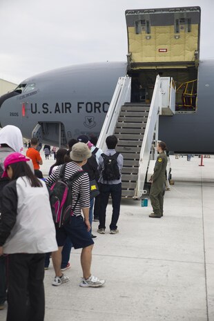 Visitors wait in line to enter a U.S. Air Force KC-135 Stratotanker during the Japan Maritime Self-Defense Force/Marine Corps Air Station Iwakuni Friendship Day 2015 Air Show aboard MCAS Iwakuni, Japan, May 3, 2015. This year the event expanded to combine both the Fleet Air Wing 31 annual Open House and the traditional MCAS Iwakuni Friendship Day, resulting in the first ever joint Friendship Day air show. The event allowed visitors a chance to see the military installation and interact with Japanese and American service members while enjoying performances from the Breitling Wingwalkers, Blue Impulse and much more.
