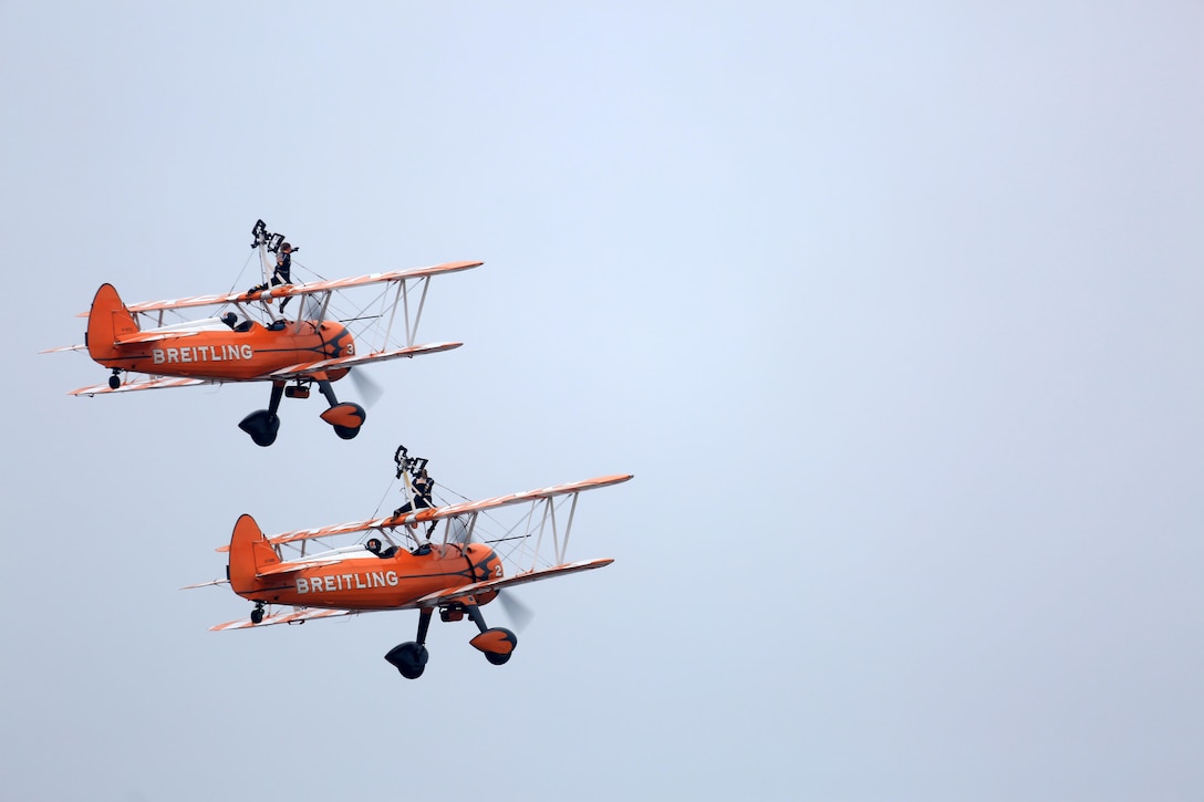 The Breitling Wingwalkers perform for visitors during the Japan Maritime Self-Defense Force/Marine Corps Air Station Iwakuni Friendship Day 2015 Air Show, May 3, 2015, aboard MCAS Iwakuni, Japan. Their Friendship Day performance marks the first display the Breitling team has ever done in Japan. Friendship Day presented visitors, from near or far, the opportunity to come aboard station and interact with Japanese and American service members.