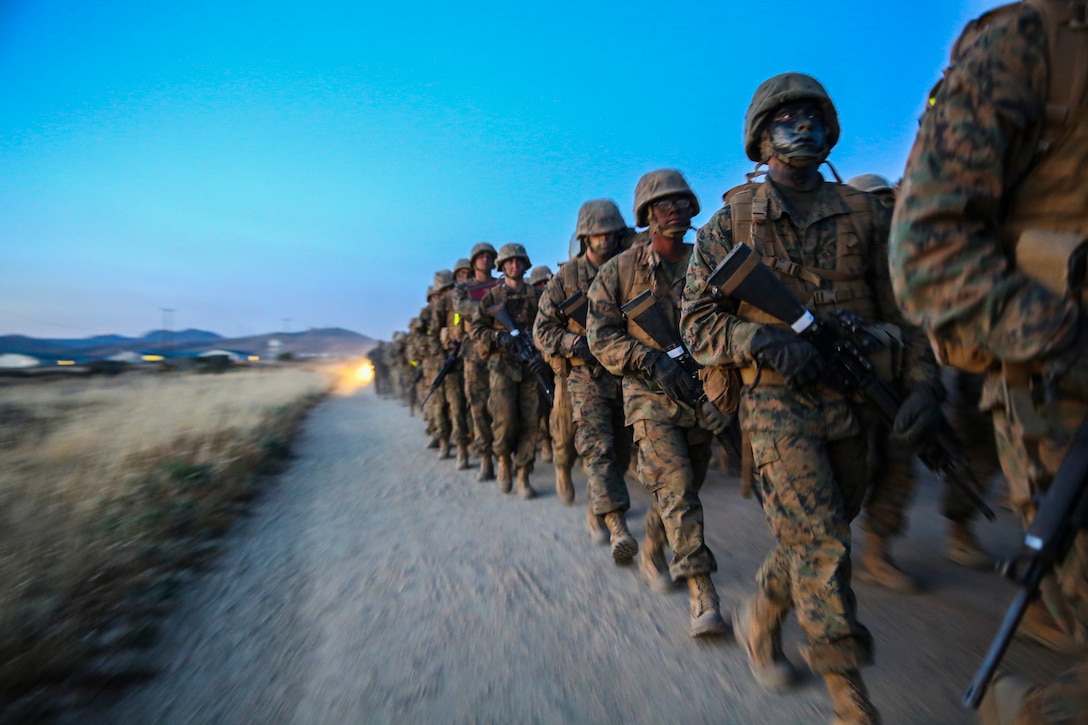 Recruits of Golf Company, 2nd Recruit Training Battalion, push through adversity to carry an ammunition can during the resupply hike at Edson Range, Marine Corps Base Camp Pendleton, Calif., April 28. The ammunition resupply hike is six kilometers and recruits take turns carrying various size ammunition cans filled with dirt simulating the weight of the rounds. Halfway through the maneuver, the ammunition cans were handed over to the company’s follow series to carry back.   Today, all male recruits recruited from recruiting stations west of the Mississippi are trained at MCRD San Diego. The depot is responsible for training approximately 16,000 recruits annually. Golf Company is scheduled to graduate May 8.