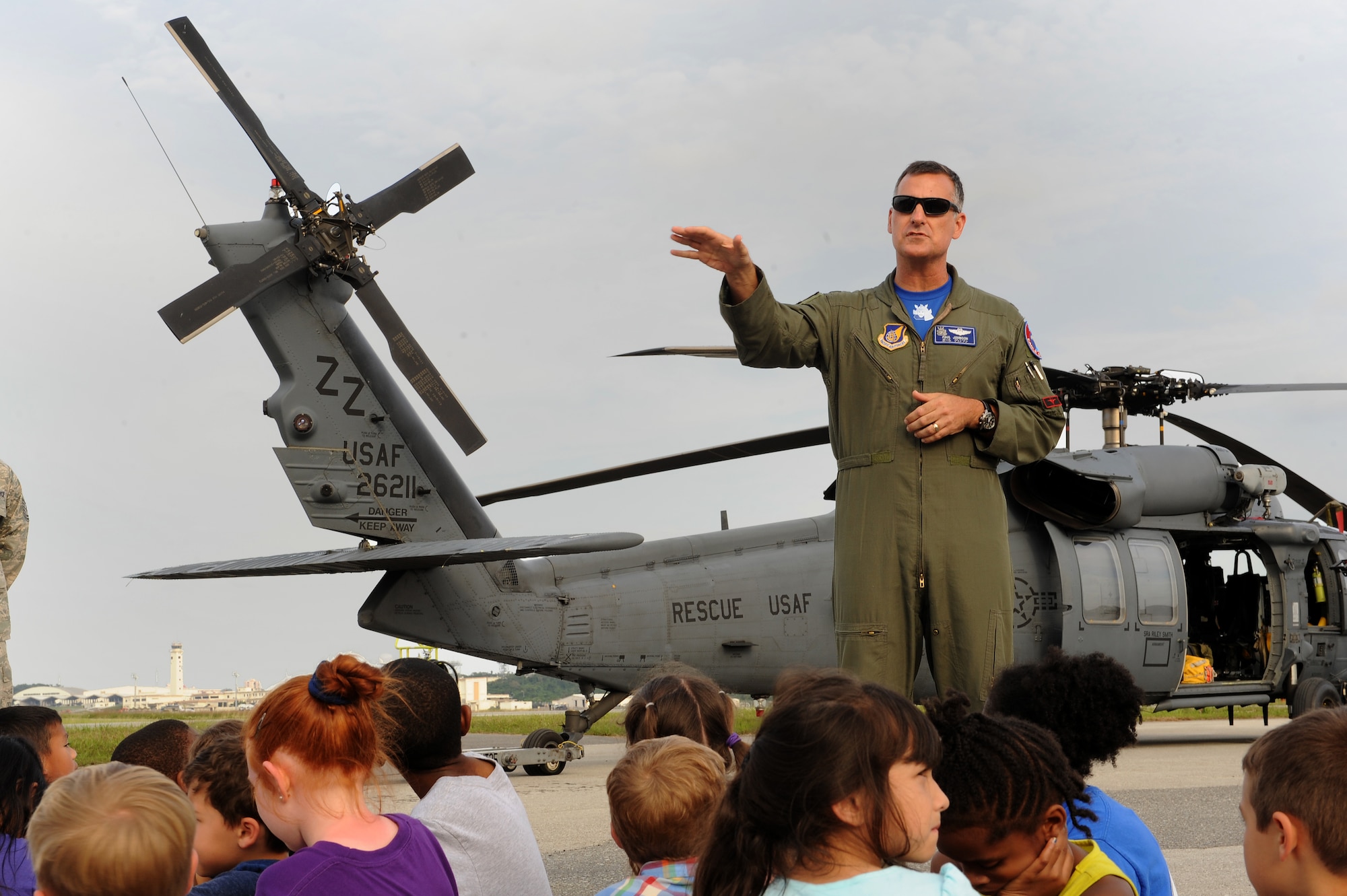 U.S. Air Force Col. Paul M. Johnson, 18th Operations Group deputy commander, gives closing remarks following a flight line tour for school-age children on Kadena Air Base, Japan, May 1, 2015. The flightline tour was the final event of the Air Force Association’s Air Power Week, a week dedicated to getting children excited about science, technology, engineering and math through basic exploration of various aircraft and their technologies. (U.S. Air Force photo by Airman 1st Class Zade C. Vadnais)