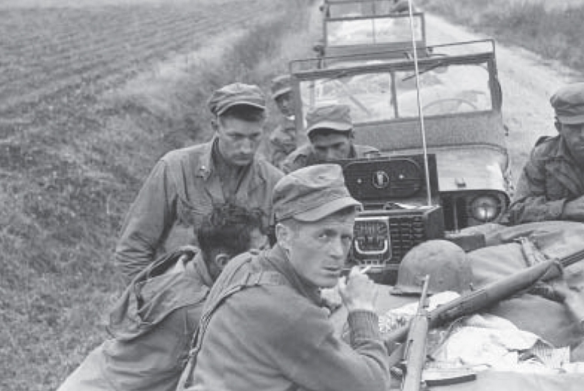 Army Lt. Olin “Short Round” Hardy and L Company infantrymen wait to hear news on the radio during the Korean War.

(Courtesy photo from the manuscript “Love Company - the predecessor to 'LOVE, Labor and Laughter'" at http://www.lovecompany.org/pdfs/LoveBook.pdf).