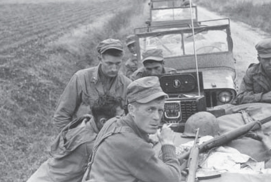 Army Lt. Olin “Short Round” Hardy and L Company infantrymen wait to hear news on the radio during the Korean War.

(Courtesy photo from the manuscript “Love Company - the predecessor to 'LOVE, Labor and Laughter'" at http://www.lovecompany.org/pdfs/LoveBook.pdf).