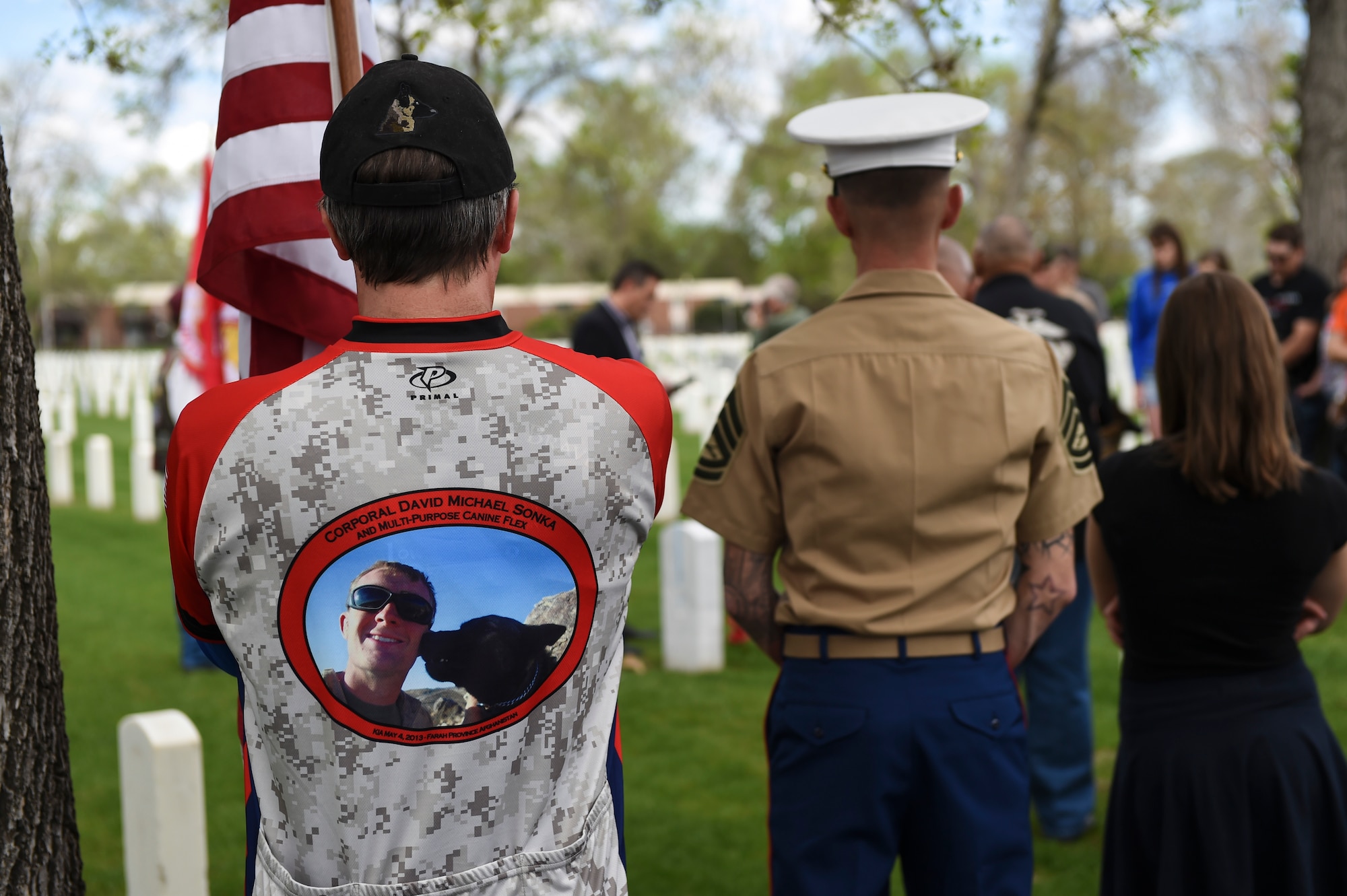 Family members and friends gather at the Cpl. David Sonka’s Memorial Service May 2, 2015, at Fort Logan National Cemetery in Denver. The weekend’s events were held to honor the life of Sonka, a U.S. Marine Corps Military Working Dog handler who was killed in action in Afghanistan May 4, 2013. The weekend’s events included a motorcade to his grave, two memorial services, the reading of the names of all MWD and MWD handlers killed in action during Vietnam and recent years, a BBQ, and concluded with a multi-service dog handling competition. (U.S. Air Force photo by Senior Airman Phillip Houk/Released)