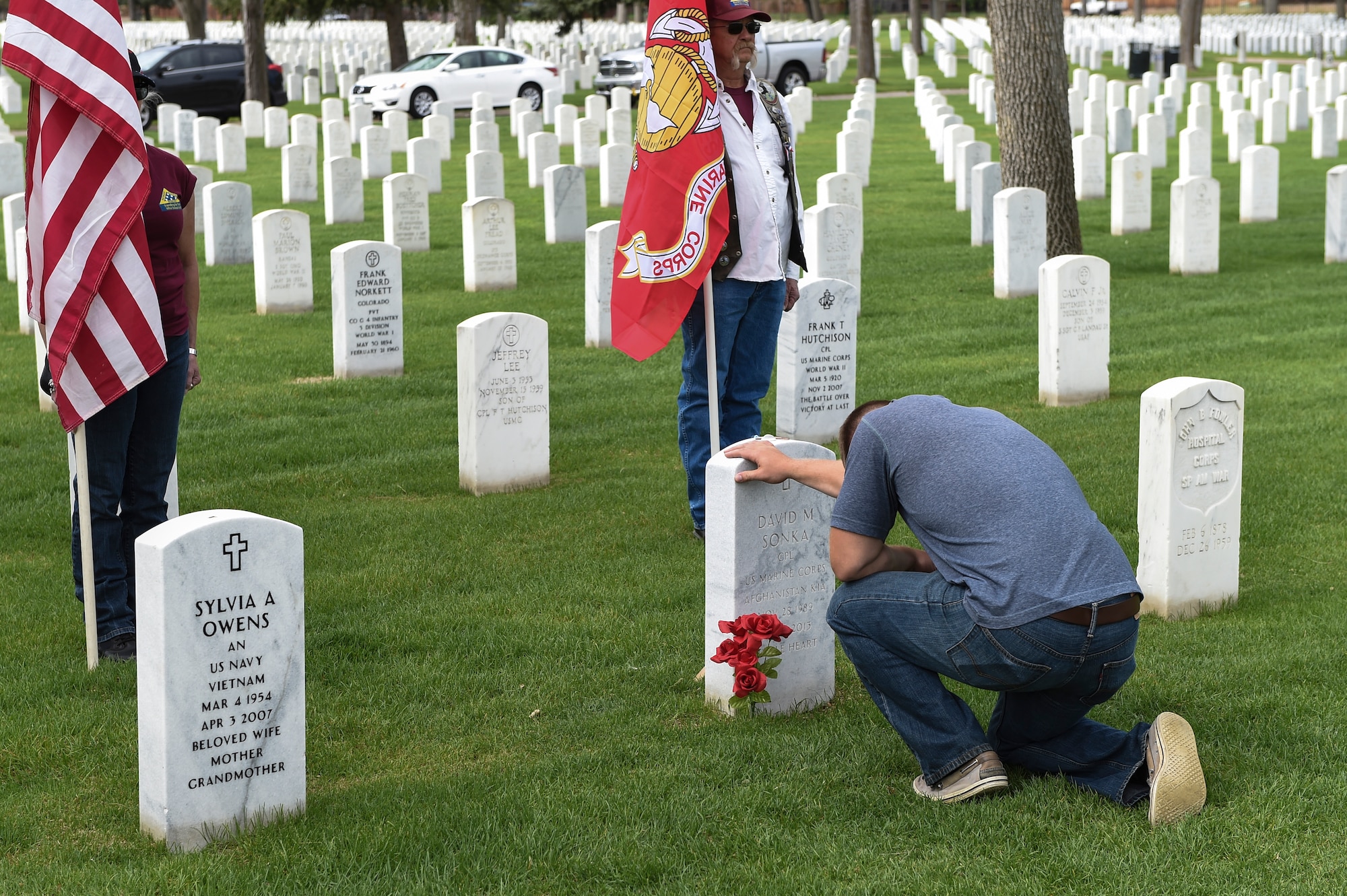 Family members and friends gather at the Cpl. David Sonka’s Memorial Service May 2, 2015, at Fort Logan National Cemetery in Denver. The weekend’s events were held to honor the life of Sonka, a U.S. Marine Corps Military Working Dog handler who was killed in action in Afghanistan May 4, 2013. The weekend’s events included a motorcade to his grave, two memorial services, the reading of the names of all MWD and MWD handlers killed in action during Vietnam and recent years, a BBQ, and concluded with a multi-service dog handling competition. (U.S. Air Force photo by Senior Airman Phillip Houk/Released)