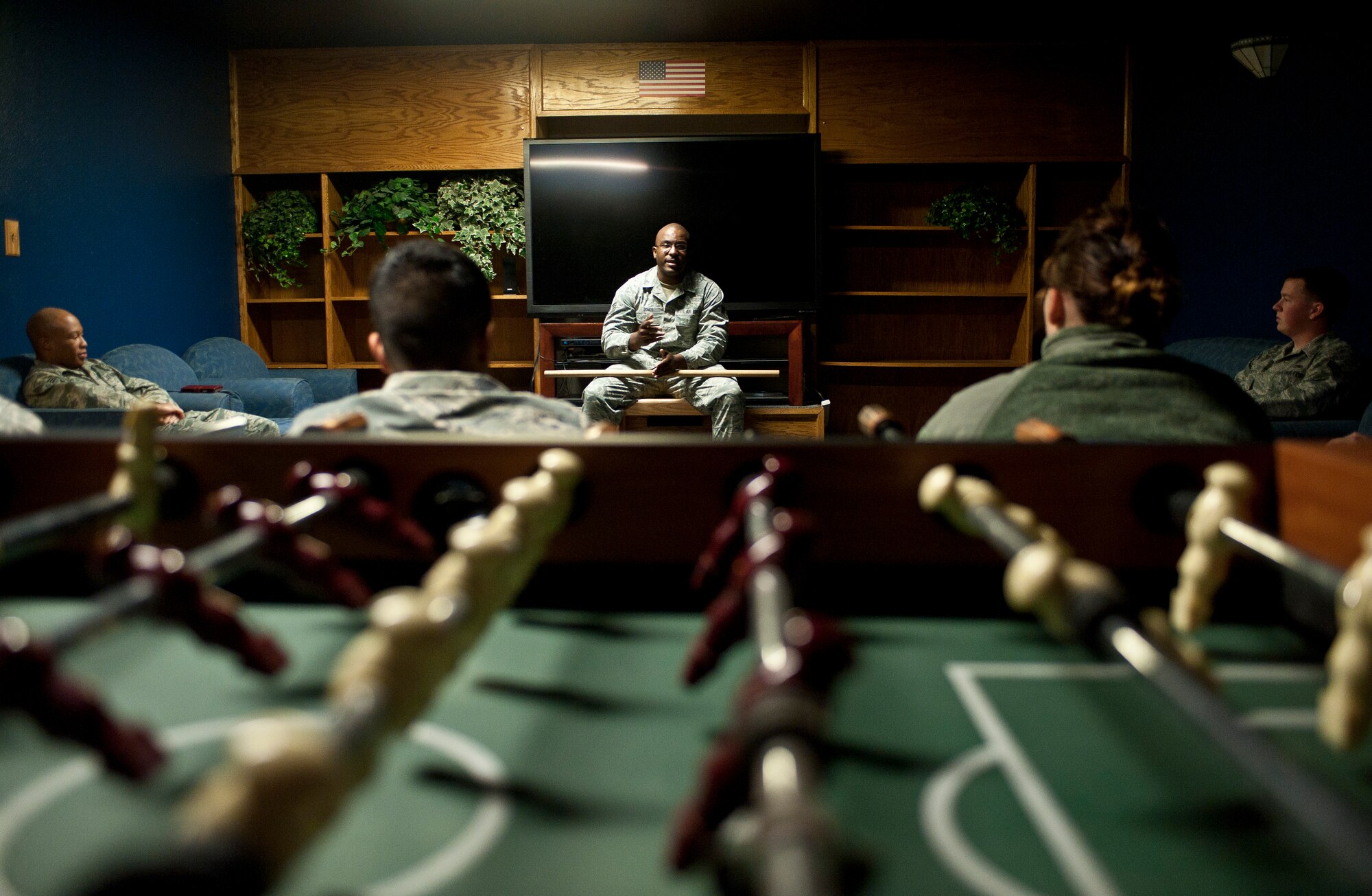 Staff Sgt. Council Jones, 99th Civil Engineer Squadron airman dormitory leader, talks to a group of Airmen at Nellis Air Force Base, Nev., April 7, 2015. Jones credits his mentors with his success in the Air Force, and now passes on what he can to younger Airmen. (U.S. Air Force photo by Staff Sgt. Siuta B. Ika)