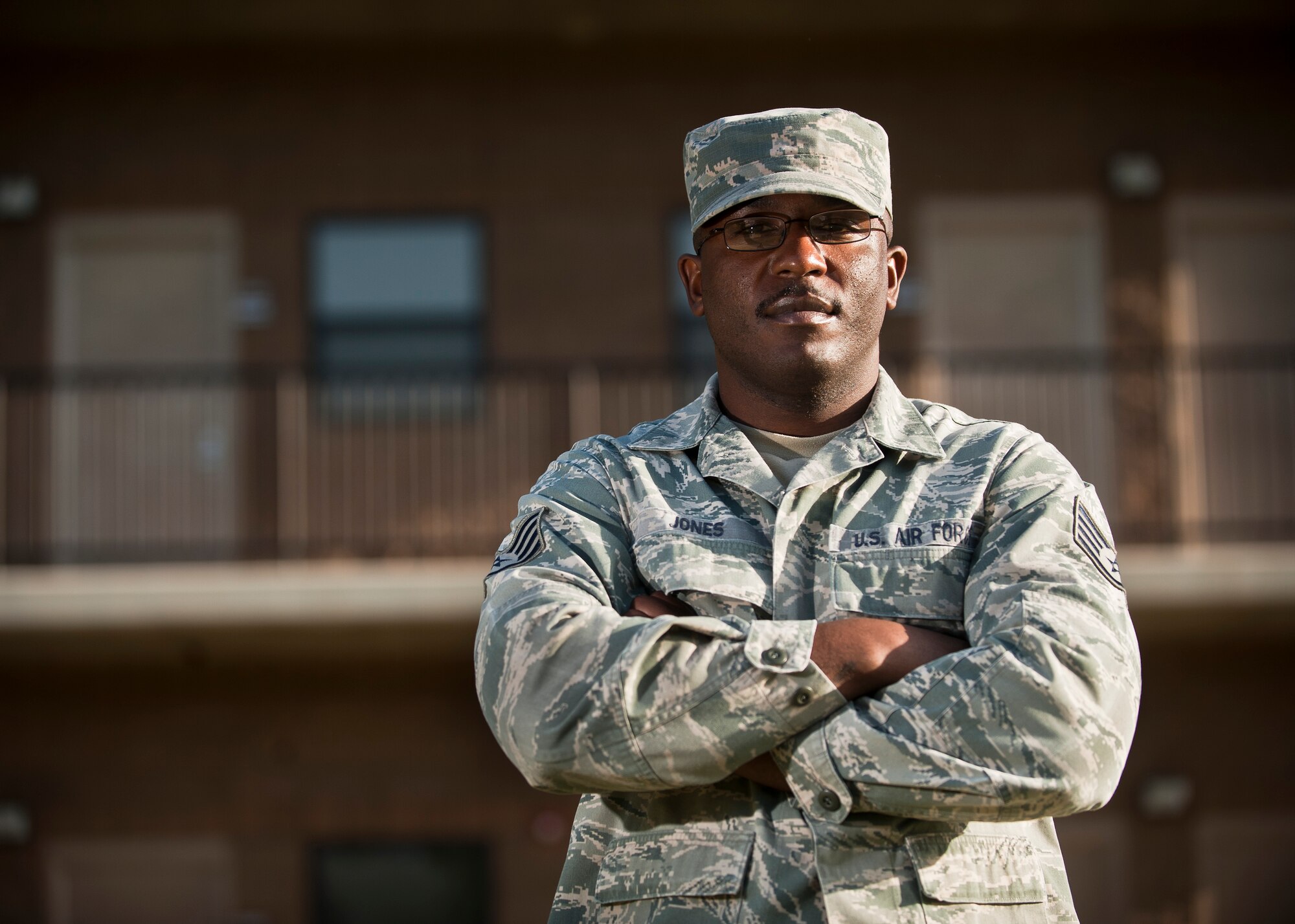 Staff Sgt. Council Jones, 99th Civil Engineer Squadron airman dormitory leader, poses for a photo in front of a dorm on Nellis Air Force Base, Nev., April 7, 2015. As a young Airman, Jones spent 30 days in a correctional confinement facility for an expletive-laced rant directed toward his squadron leadership, but has overcome that past adversity to have a successful Air Force career in which he has won numerous Airman of the Quarter awards and the 52nd Fighter Wing’s Airman of the Year award, and has deployed to Iraq and Afghanistan as a security forces member. (U.S. Air Force photo by Staff Sgt. Siuta B. Ika)