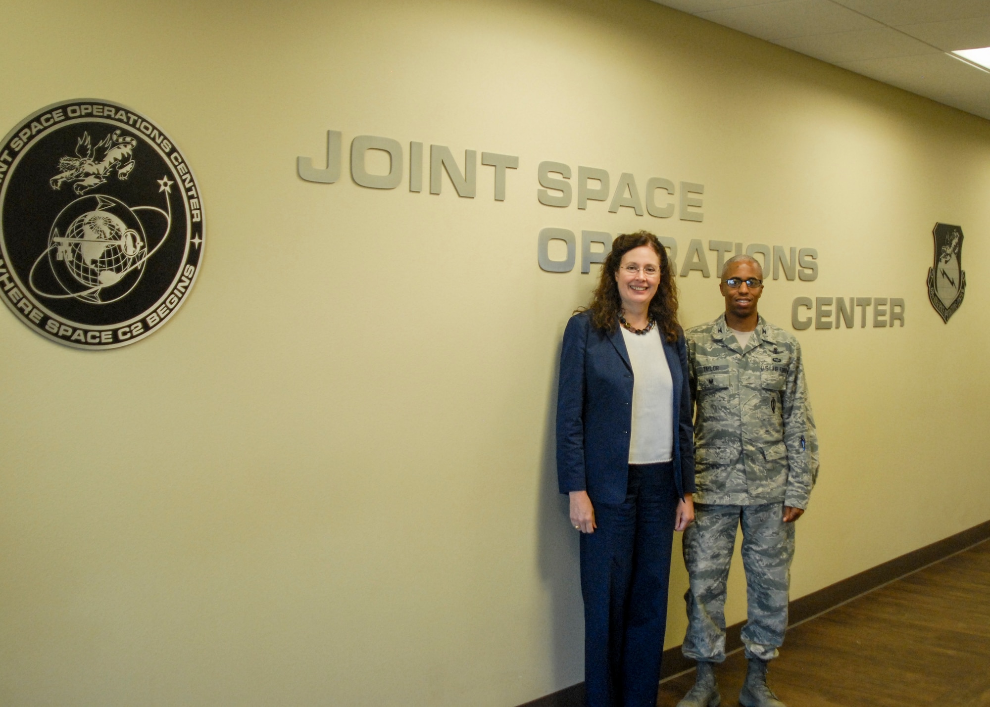 Dr. Merri Sanchez, Air Force Space Command Chief Scientist and Technical Advisor, poses for a photo with Col. Fred Taylor, deputy director, Joint Space Operations Center, Vandenberg Air Force Base, Calif., during a visit, here, May 1, 2015.  In addition to the JSpOC, Sanchez visited facilities operated by Joint Functional Component Command for Space, 14th Air Force (Air Forces Strategic) and the 30th Space Wing to gain insight into how AFSPC might better train and equip its personnel to accomplish vital space missions. (U.S. Air Force photo by Capt. Nicholas Mercurio/Released)