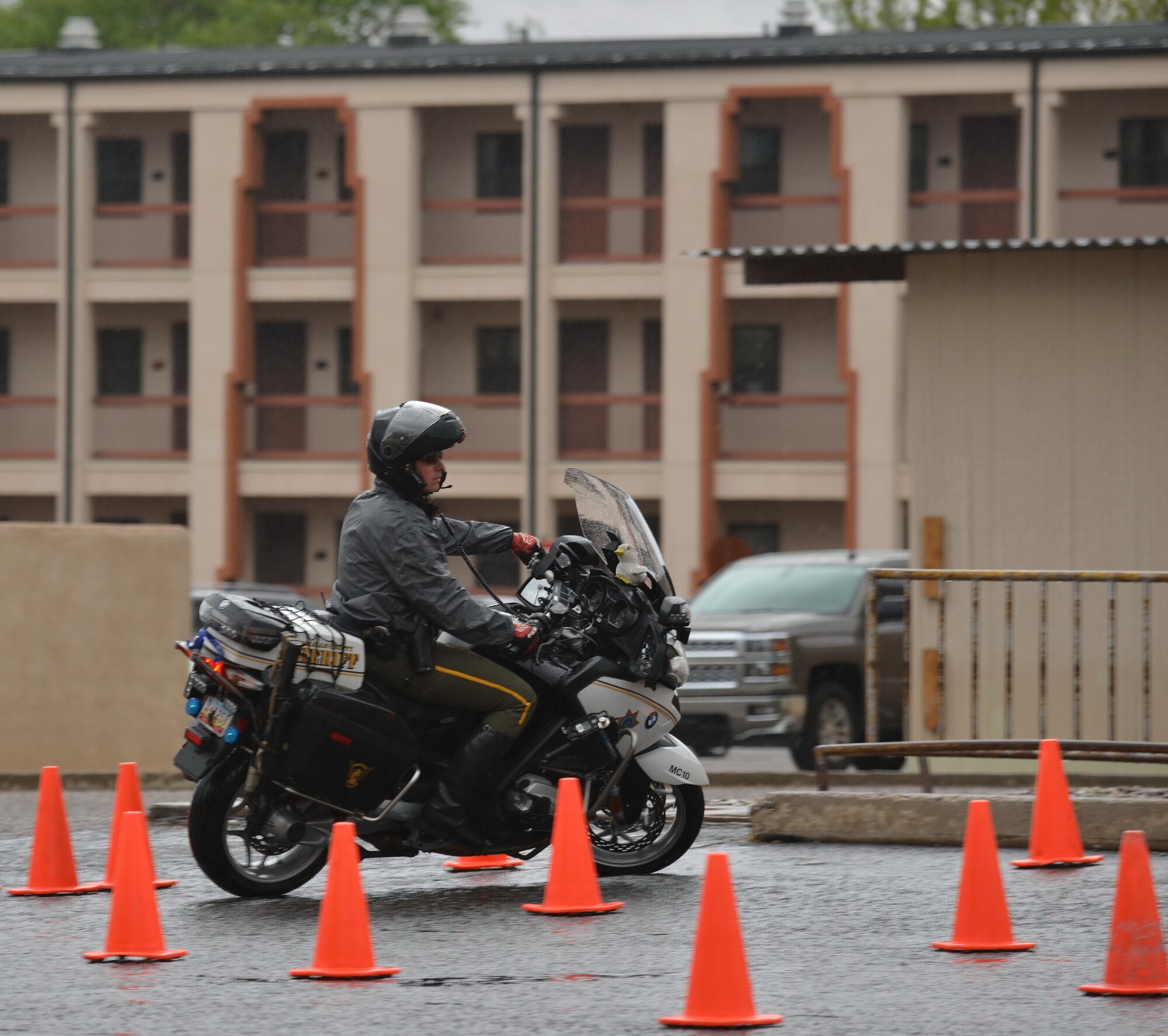 A member of the Bernalillo County Sheriff’s Department rides an obstacle course as part of
a recent presentation on motorcycle safety. (Photo by Jamie Burnett)