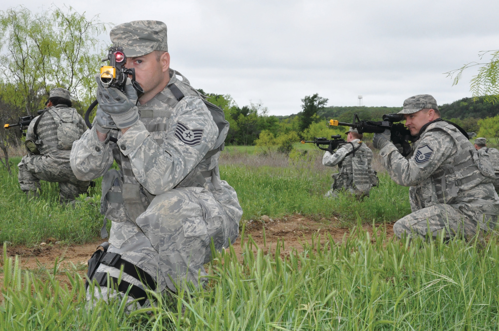 FORT WOLTERS TRAINING CENTER, TEXAS - Tech Sgt. William Akers and Master Sgt. William Speakman, 445th Security Forces Squadron, take positions during a Patriot Defender training practical April 14 at Fort Wolters Training Center, Texas. The two-week sustainment course takes SFS troops through the paces of core security forces tasks. (U.S. Air Force photo/Capt. Elizabeth Caraway)