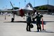 An instructor pilot with the 96th Flying Training Squadron, left, speaks with a student pilot about the F-35 Lightning II at Laughlin Air Force Base, Texas, May 1, 2015. As team XL seeks to graduate the world’s best pilots, this experience provided the next-generation of warfighter’s an opportunity to view the aircraft up-close and personal, receive briefings from the pilots and maintenance professionals and learn about its important role in the Air Force mission. (U.S. Air Force photo by Tech. Sgt. Steven R. Doty)