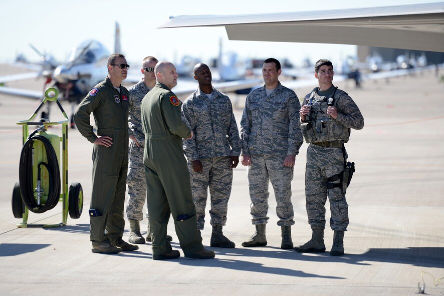 Maj. William Andreotta, 56th Training Squadron assistant director of operations, talks with Airmen at Laughlin Air Force Base, Texas, May 1, 2015. Luke’s critical role in the F-35 Lightning II mission is focused on training and producing U.S. and international pilots for the U.S. Air Force’s initial operational capability in August of 2016. (U.S. Air Force photo by Tech. Sgt. Steven R. Doty)