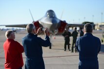 Danny Williams, 47th Student Squadron Simulator instructor, captures images of the F-35 Lightning II sits at Laughlin Air Force Base, Texas, May 1, 2015. The two F-35’s are based out of the 61st Fighter Squadron, nicknamed “Top Dogs”, at Luke Air Force Base, Arizona. (U.S. Air Force photo by Tech. Sgt. Steven R. Doty)