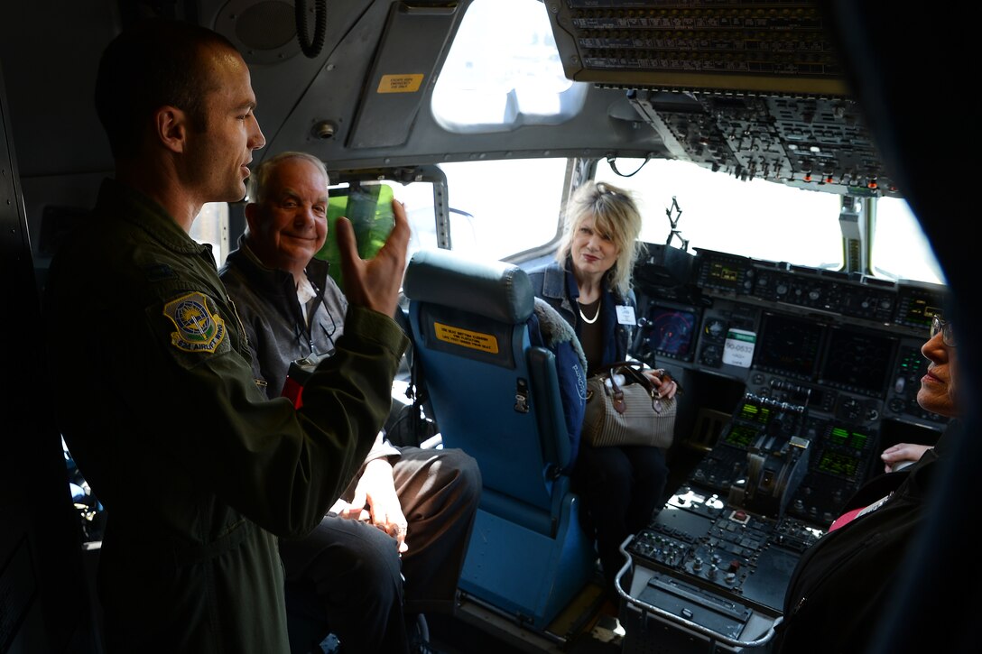 Capt. Bill Booth, 7th Airlift Squadron pilot, briefs members the Seattle 4 Rotary Club about the capabilities of the C-17 Globemaster III April 30, 2015, at Joint Base Lewis-McChord, Wash. The rotary club members toured the C-17 and learned about the various missions the 62nd and 446th Airlift Wings utilize the aircraft for. (U.S. Air Force photo\Staff Sgt. Tim Chacon)