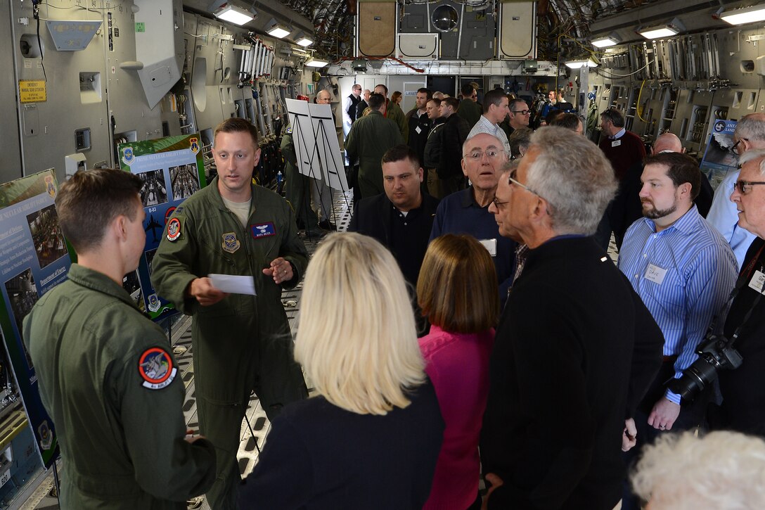 Members of the Seattle 4 Rotary Club tour a C-17 Globemaster III April 30, 2015, at Joint Base Lewis-McChord, Wash. The rotary club members were briefed on the various missions the 62nd and 446th Airlift Wings perform in the C-17 and the unique capabilities of the aircraft. (U.S. Air Force photo\Staff Sgt. Tim Chacon)