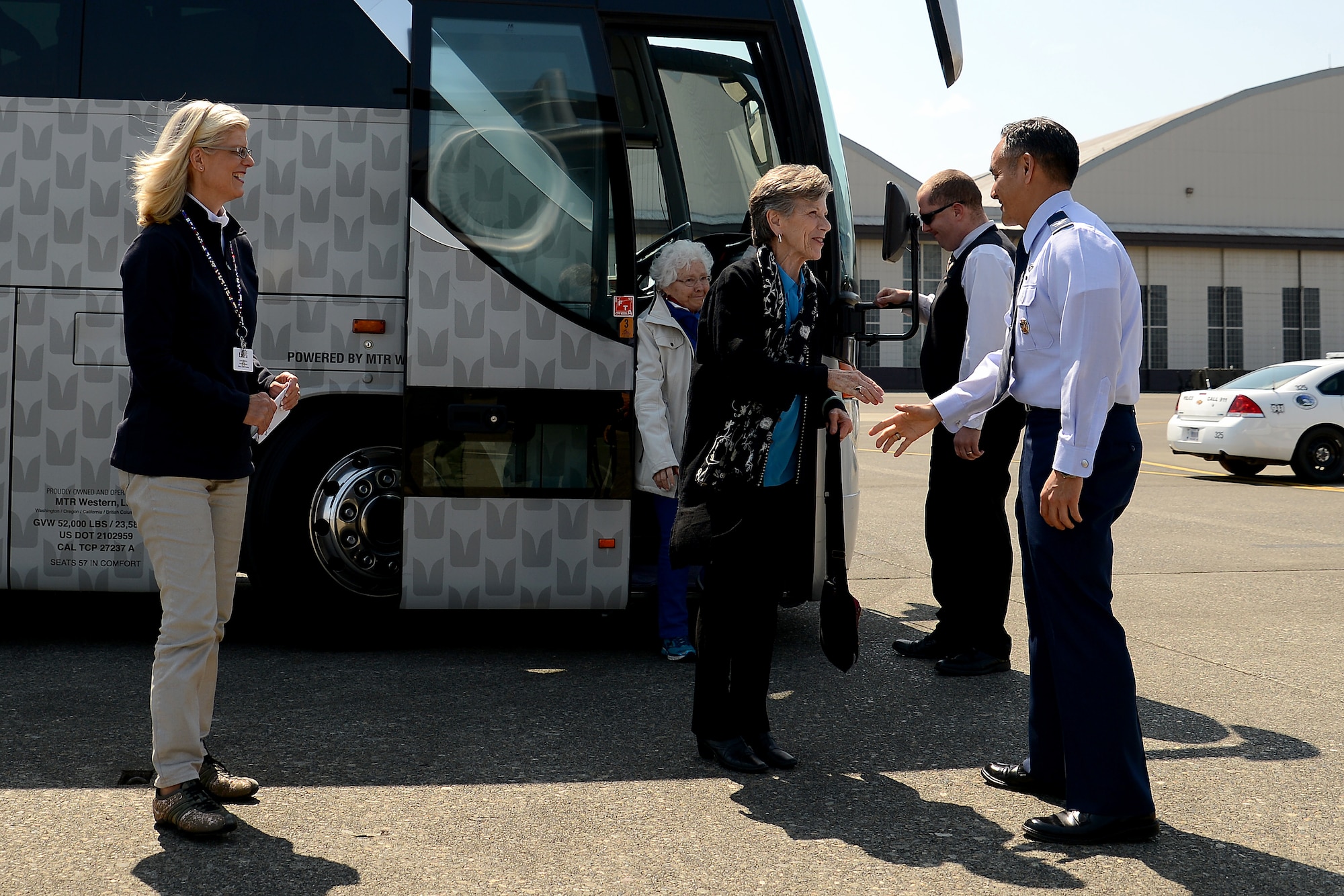 Col. David Kumashiro, 62nd Airlift Wing commander, greets members of the Seattle 4 Rotary Club April 30, 2015, at Joint Base Lewis-McChord, Wash. The rotary club toured JBLM to get a better understanding of the base and mission of JBLM units. (U.S. Air Force photo\Staff Sgt. Tim Chacon) 