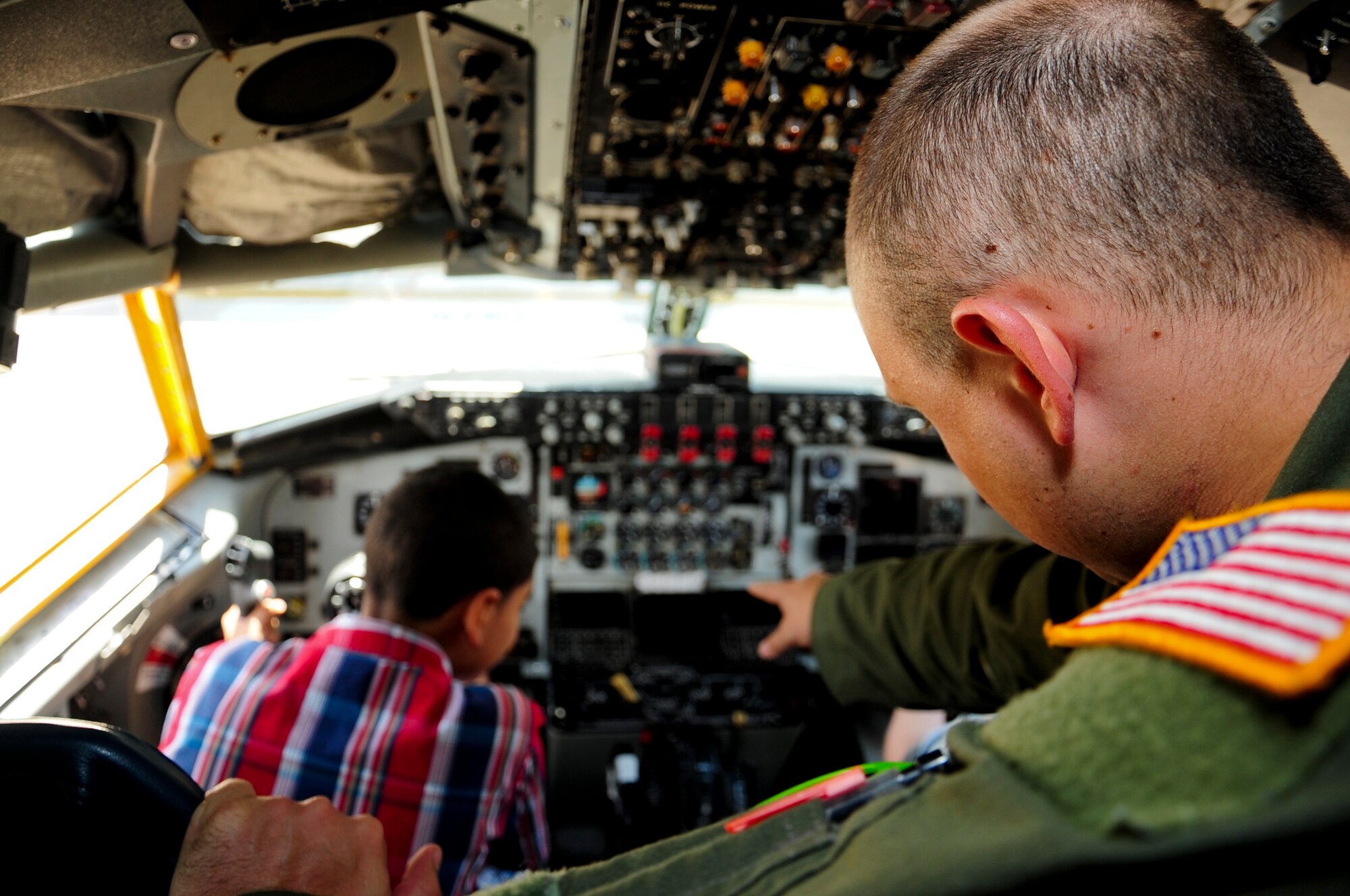 A crew member from the 6th Maintenance Group shows the Rising Stars from Gibsonton Elementary School the inside of a KC-135 Stratotanker May 1, 2015 at MacDill Air Force Base, Fla. During the visit, the children were able to see demonstrations from Military Working Dogs, Explosive Ordnance Disposal, the fire department and a KC-135 Stratotanker static display. (U.S. Air Force photo by Senior Airman Jenay Randolph/Released)