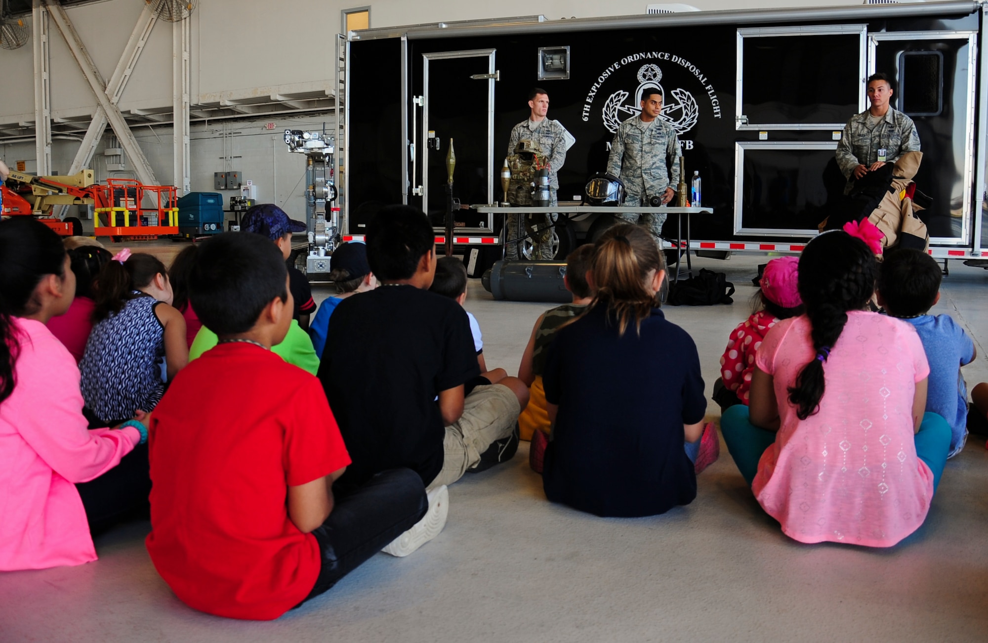 Rising Stars from Gibsonton Elementary School watch an Explosive Ordnance Disposal demonstration May 1, 2015, at MacDill Air Force Base, Fla.  Approximately 50 students were selected to visit MacDill and experience various operations on the base. (U.S. Air Force photo by Senior Airman Jenay Randolph/Released) 