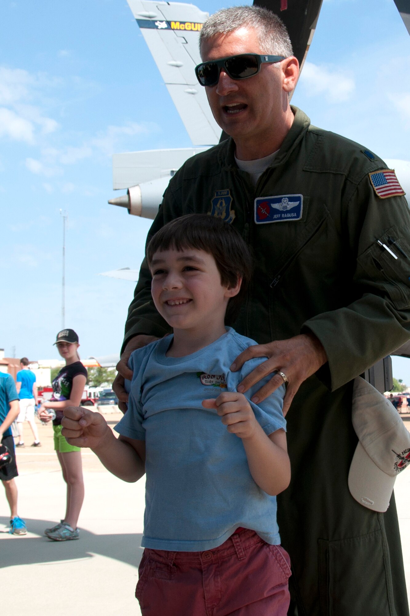 U.S. Air Force Lt. Col. Jeff Ragusa, 403rd Wing pilot, with the help of volunteer Grayson Davis prepares to demonstrate to a crowd of onlookers what it is like to fly into the eye a hurricane during the Defenders of Liberty Air Show at Barksdale Air Force Base, La., May 2, 2015.  Ragusa has completed more than 50 missions flying into hurricanes to gather vital meteorological information. (U.S. Air Force photo by Tech. Sgt. Ted Daigle/ Released)