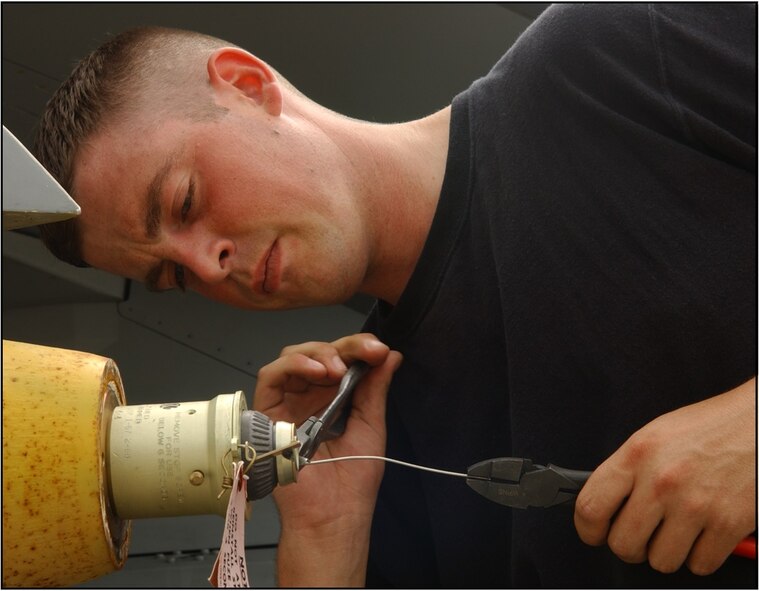 Montana Air National Guard Armament Systems Specialist Staff Sgt. Carl Valvoda prepares a fuse on a Mk-82 general purpose bomb while deployed  to Kunsan Air Base, Republic of Korea July 5, 2006. (U.S. Air Force photo/Staff Sgt. Becky Nelson)
